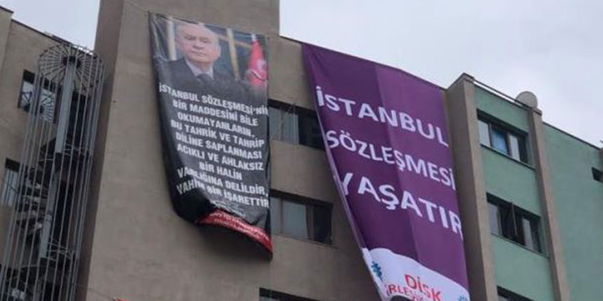 Kocaeli'de aynı binada afişler savaşı! Bu kez MHP'den hamle geldi