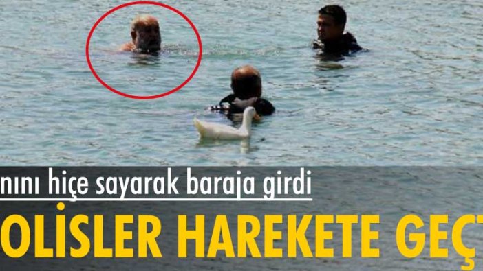 Baraj kapaklarının önünde yüzen bir kişi dalgıç polisleri tarafından zor ikna edildi