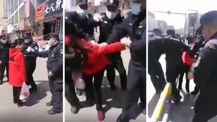 Çin'de maske takmayı reddeden bir kadını darp edilerek gözaltına alındı!