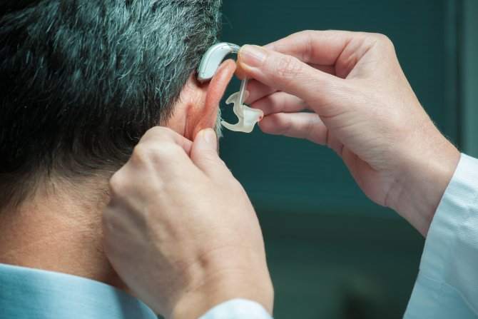 man-getting-fitted-for-hearing-aid-gettyimages-508627809.jpg